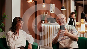 Senior couple talk on online videocall