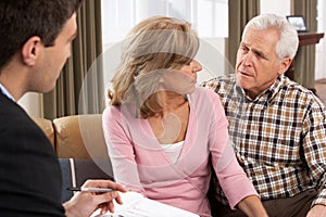 Senior Couple Talking With Financial Advisor