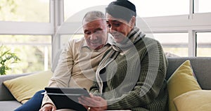 Senior couple, talking on tablet and conversation or communication in home with social media, network or connection