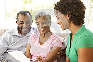 Senior Couple Talking To Financial Advisor