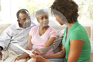 Senior Couple Talking To Financial Advisor