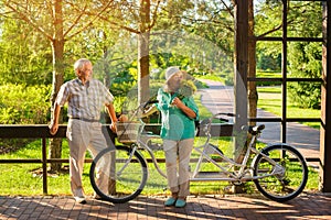 Senior couple and tandem bicycle.