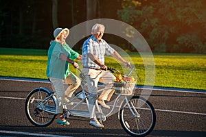 Senior couple on tandem bike.