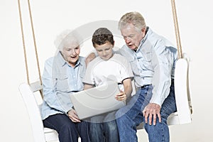 Senior couple with their grandson