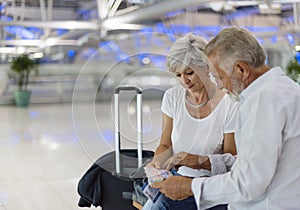 Senior couple traveling in an airport scene