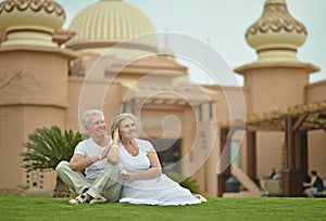 Senior couple at tropic hotel garden