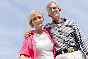 Senior couple under blue sky