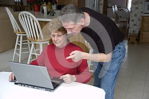 Senior Couple Using Laptop, Internet, Technology