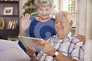 Senior couple using tablet