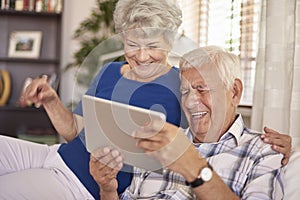 Senior couple using tablet