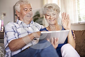 Senior couple using tablet