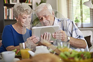 Senior couple using tablet