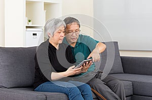 Senior couple using tablet computer