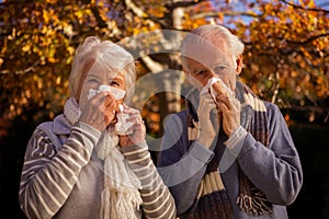 Senior couple using tissues