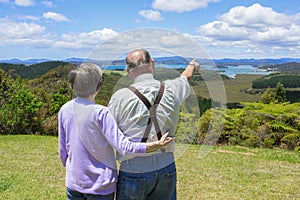 Senior Couple on vacation looking at beautiful ocean views