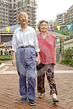 A senior couple are walking