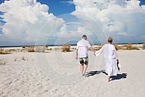 Senior couple walking beach