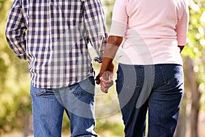 Senior couple walking in park