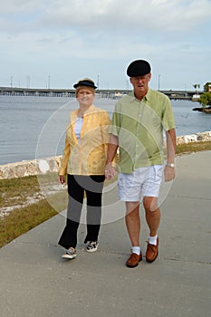 Senior couple walking in park