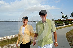 Senior couple walking in park