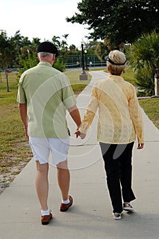 Senior couple walking in park