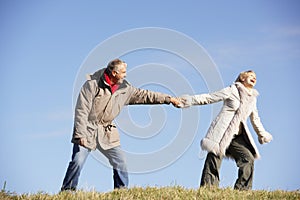 Senior Couple Walking In Park