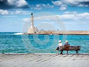 Senior Couple watching Old Harbor, Chania, Crete, Greece