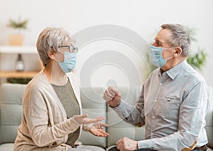 Senior couple wearing facemasks