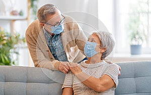 Senior couple wearing facemasks