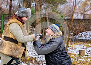 Christmas Holidays, woman and senior man walk at park