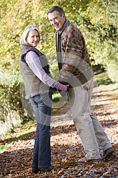 Senior couple on woodland walk