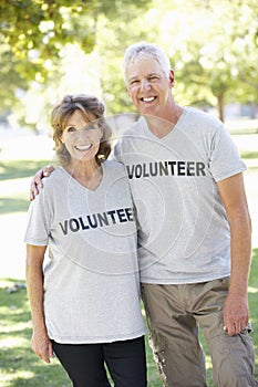 Senior Couple Working As Part Of Volunteer Group