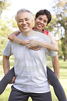 Senior Couple Working Out In Park