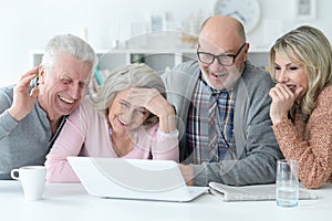 Senior couples using laptop