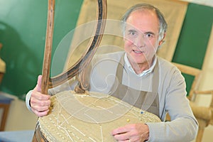 Senior craftman fixing chair