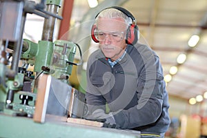 Senior craftsman in workshop