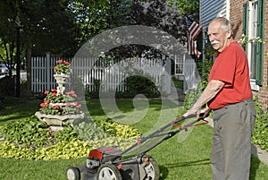 Senior Ctizen Mowing Lawn