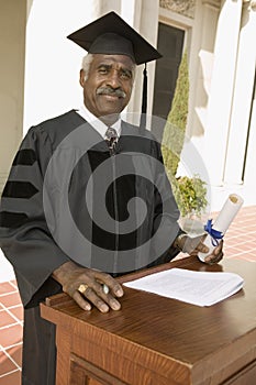 Senior Dean Standing At Podium photo