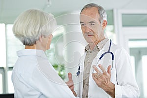 senior doctor with elderly patient