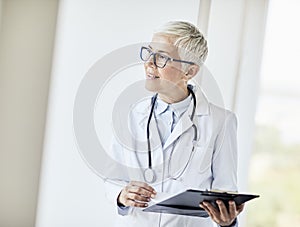 senior doctor hospital medical medicine health care clinic office woman gray hair stethoscope portrait elderly