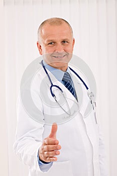 Senior doctor male smiling welcoming handshake