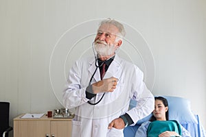 Senior doctor men show stethoscope for listening heart rate at hospital