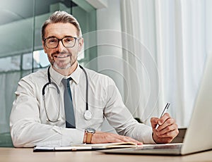 Senior doctor, writing and portrait of a hospital worker in a office doing medical research. Happiness, laptop and