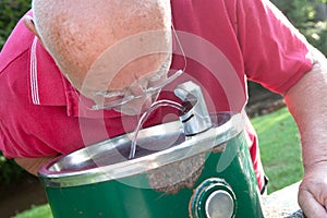 Senior Drinking from Fountain