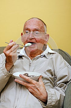 Senior eating ice cream