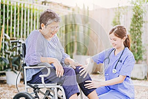 senior elderly adult woman with disability wheelchair in home care nurse doctor or physiotherapist help support relax outdoor