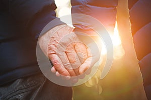 Senior elderly couple holding hands