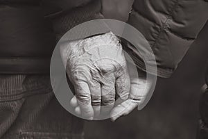 Senior elderly couple holding hands black and white