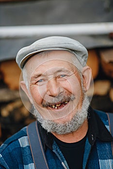 Senior elderly man with no teeth and caries looks smiles