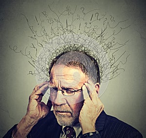Senior elderly man with worried stressed face expression looking down